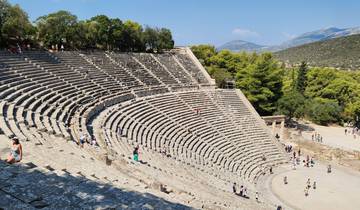 Ancient amphitheater with tourists exploring.