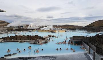 The Blue Lagoon filled with people enjoying the hot springs.