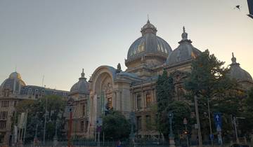 Imposing historical building with domes and arched entrance.