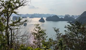 Scenic view of Halong Bay with boats and limestone islands.