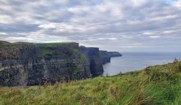 View of the Cliffs of Moher with dramatic sky.