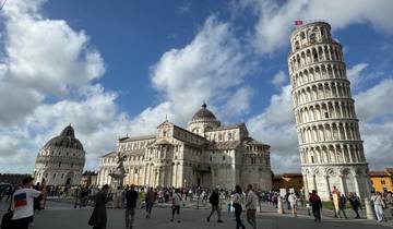 Leaning Tower of Pisa with a lively square and buildings
