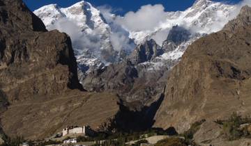 Mountain range with snow-capped peaks and rocky landscape.