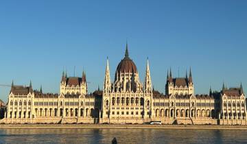 Panoramic view of a grand building by the river.
