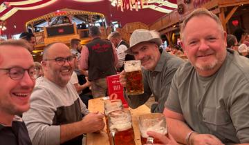 Group of men enjoying beers indoors