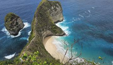 Beautiful beach with a cliff and turquoise waters at Nusa Penida.