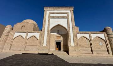 Historic building with distinctive arches and intricate brickwork.