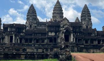 Ancient temple complex with towers against a blue sky.