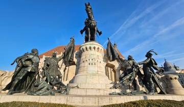 A large monument with statues surrounding it.