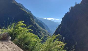 Scenic mountain valley with lush vegetation.