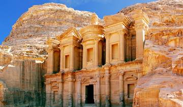 The iconic Al-Khazneh facade carved into a sandstone cliff.