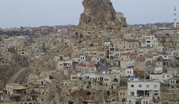 View of rocky dwellings built into a hillside.