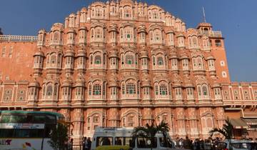 Hawa Mahal, the pink palace in Jaipur, with tourists below.
