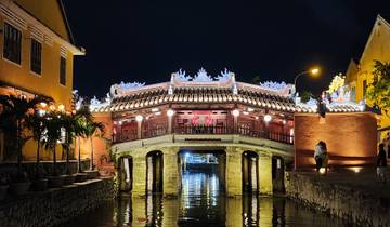 Japanese bridge illuminated at night.