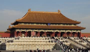 A large traditional Chinese palace with a crowd.