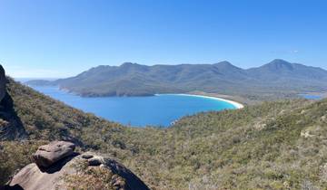 Aerial view of a bay surrounded by mountains.