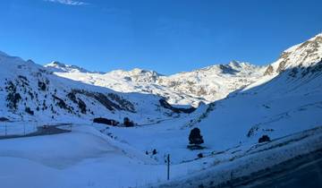 Panoramic view of a snowy mountain range.