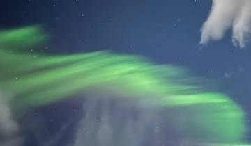 Aurora Borealis display in the night sky.