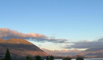 Panoramic view of a mountainous landscape under a clear sky.