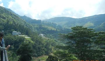 Lush green hills under a cloudy sky.