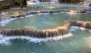 Multilevel waterfalls with turquoise water cascading down.