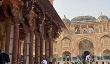 Historical building with intricate architecture and people.