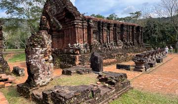 Historic ruins with people exploring.