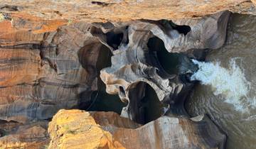 Aerial view of Bourke's Luck Potholes with swirling water patterns.