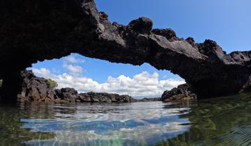 Natural stone arch over the water