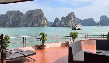 View from boat deck of towering limestone islands.