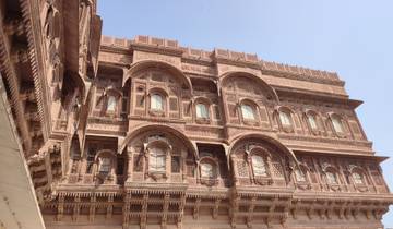 Large ornate palace with red sandstone exterior