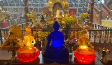 Colorful shrine with golden Buddha statues.
