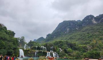 Majestic waterfall cascading down mountains.