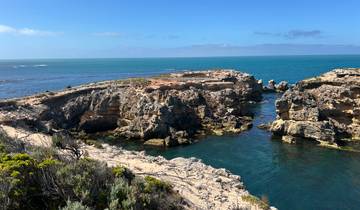 Spectacular ocean view with rocky cliffs and blue waters.