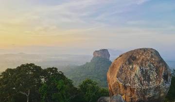Scenic view of Sigiriya rock amidst lush greenery.
