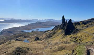 Scenic view of rock formations by the water.