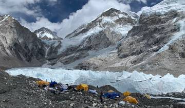Everest Base Camp with tents and snowy peaks.