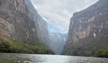 Dramatic river canyon with steep cliffs.