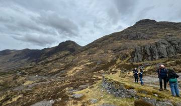 People enjoying a mountainous landscape.