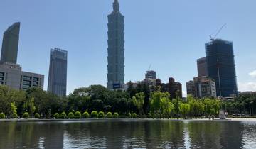 Skyline view with Taipei 101 and reflection in water.