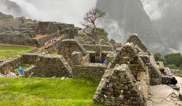 Ancient ruins at Machu Picchu surrounded by mist.