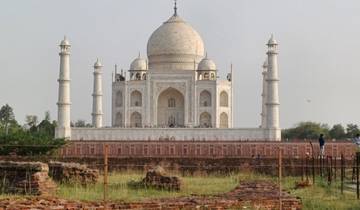 The iconic Taj Mahal with gardens in front.