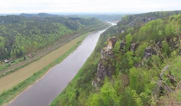 River valley with forested hills and a scenic viewpoint.