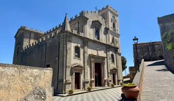 Historic stone church building in sunlight.