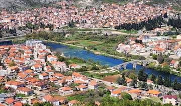 Scenic aerial view of a city with rivers and bridges.