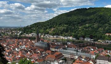 Aerial view of city with river and hills