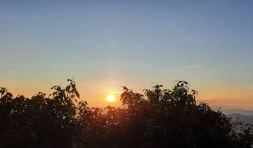 Sunset over a mountainous horizon.