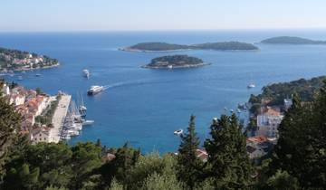 Scenic view of Hvar Island with a port and blue waters.