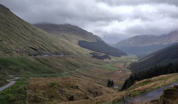 Scenic view of a lush valley with winding roads.