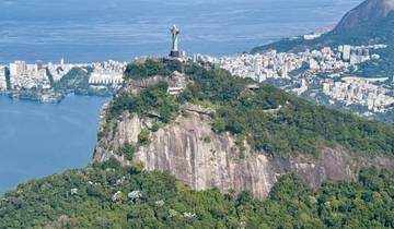 Aerial view of Christ the Redeemer statue overlooking the city and coastline.